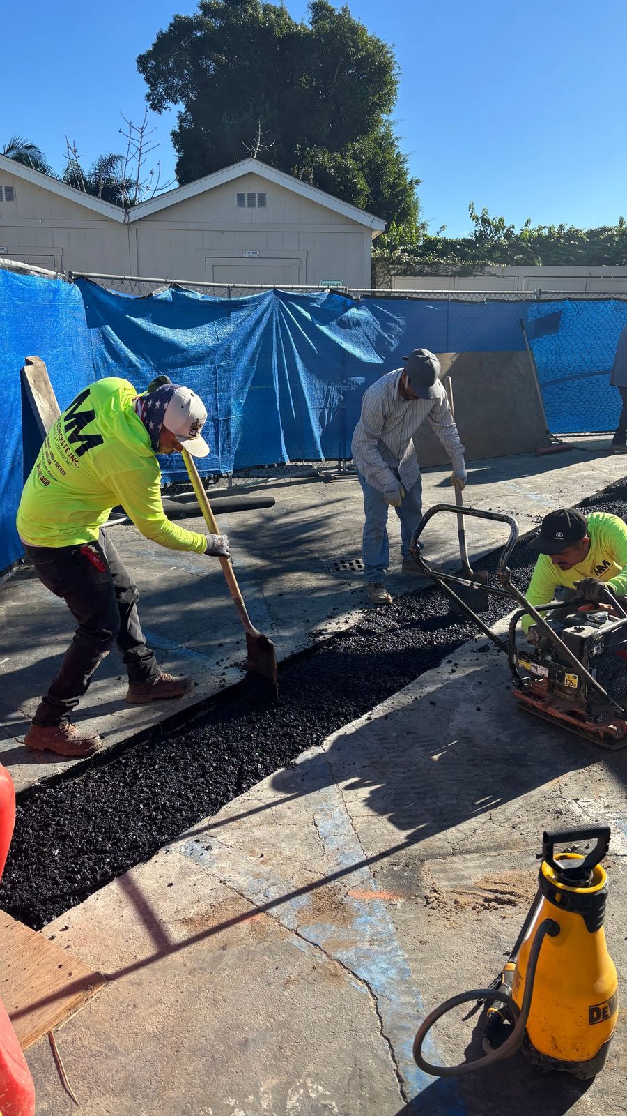 M&M Concrete crew compacting base before a pour