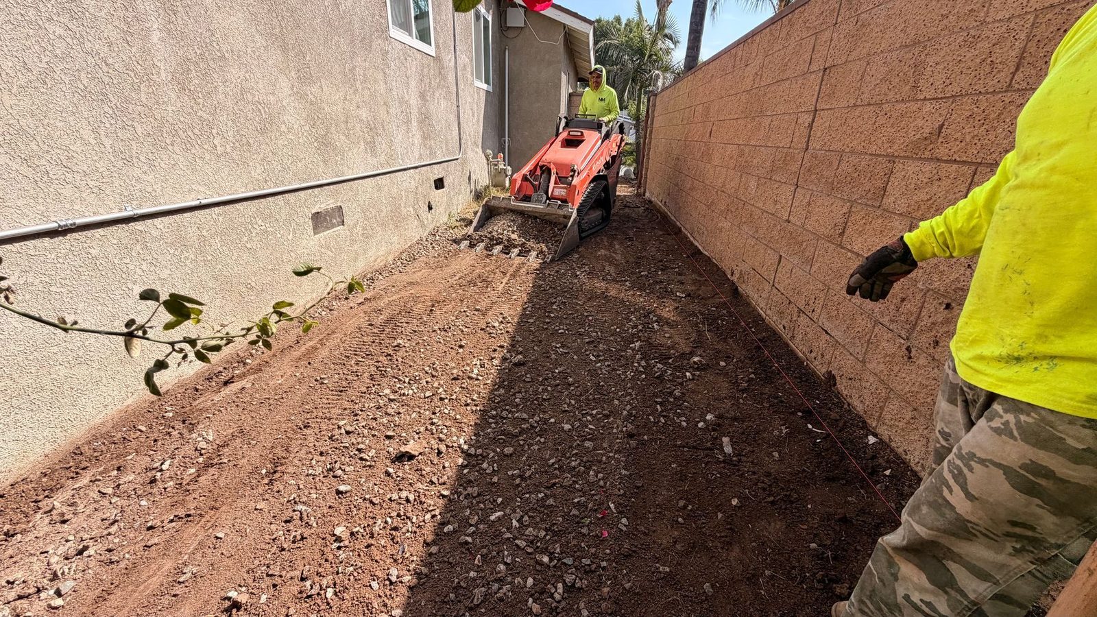 Cutting a trench in a narrow side yard