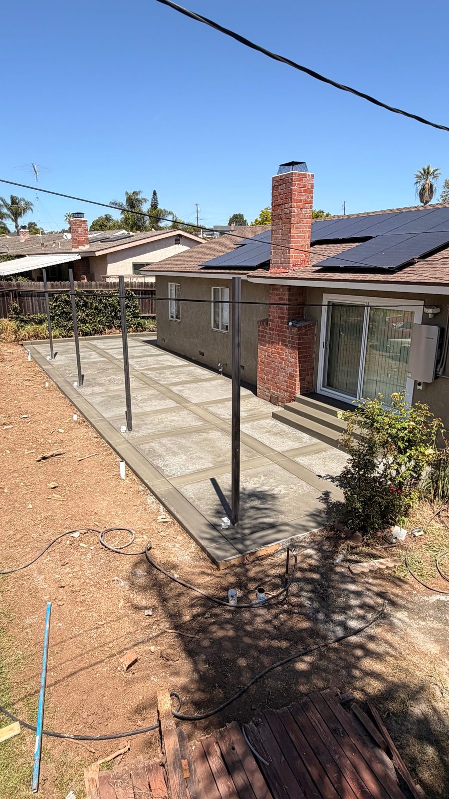 Backyard patio slab poured behind a home