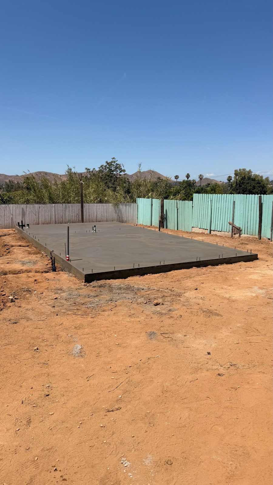 Finished concrete slab on a graded and compacted pad