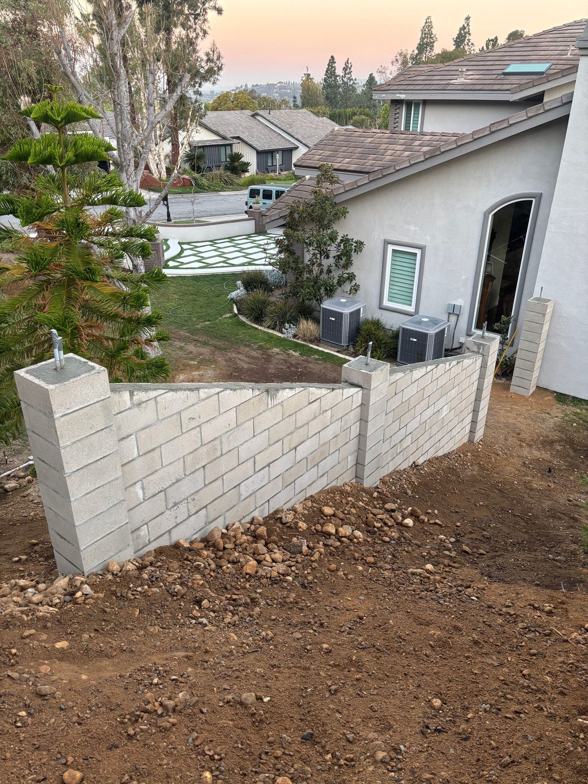 During: footing poured, first courses going up